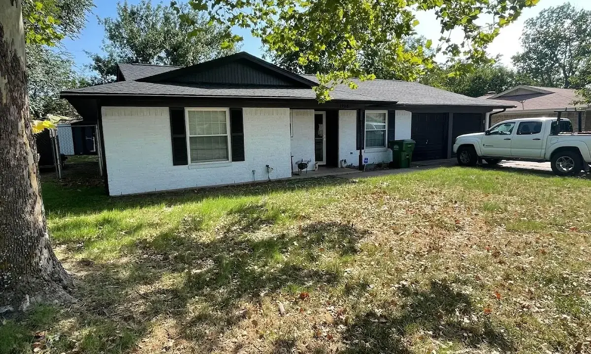 Professional roofing crew working on a residential roof in Macon-Bibb County